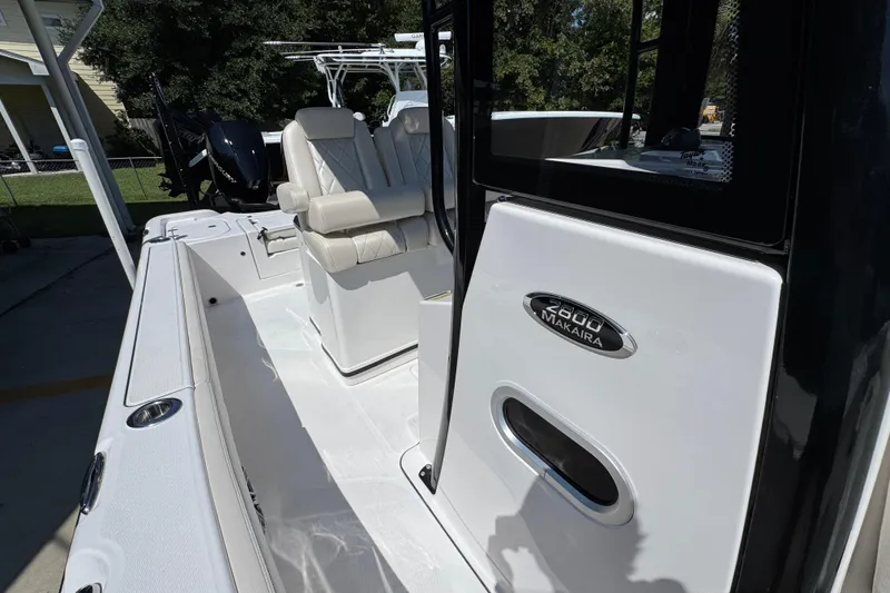 Slide: The Image of 2026 Blazer 2800 Makaira boat interior with seating and branding detail. - 26