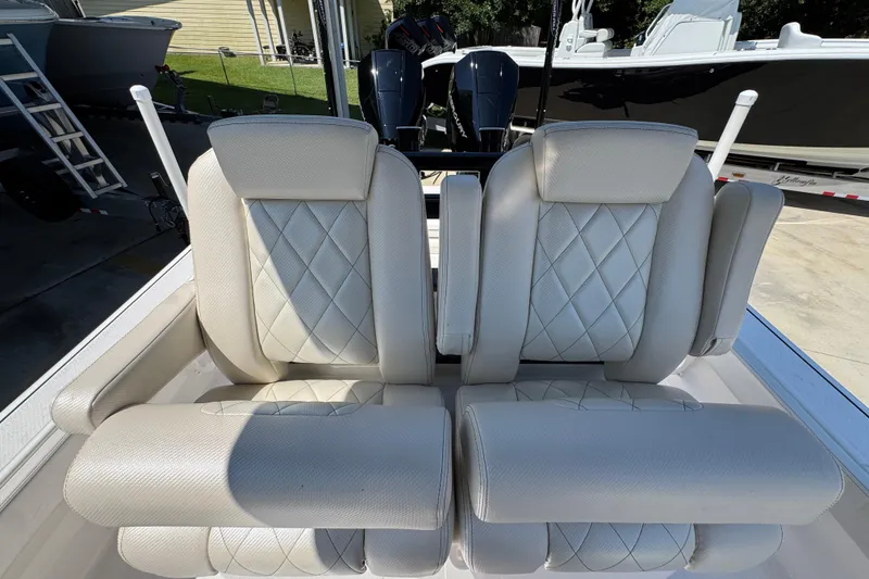 Slide: The Image of 2026 Blazer 2800 Makaira boat seats with diamond-pattern upholstery and armrests. - 30