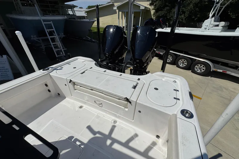 Slide: The Image of 2026 Blazer 2800 Makaira boat deck with dual Mercury outboard engines. - 39