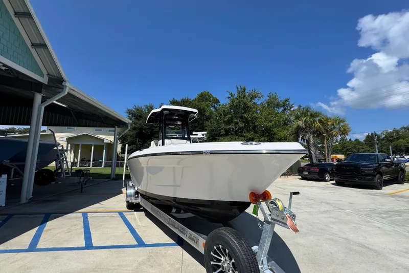 Slide: The Image of 2026 Blazer 2800 Makaira boat on trailer under clear blue sky. - 7