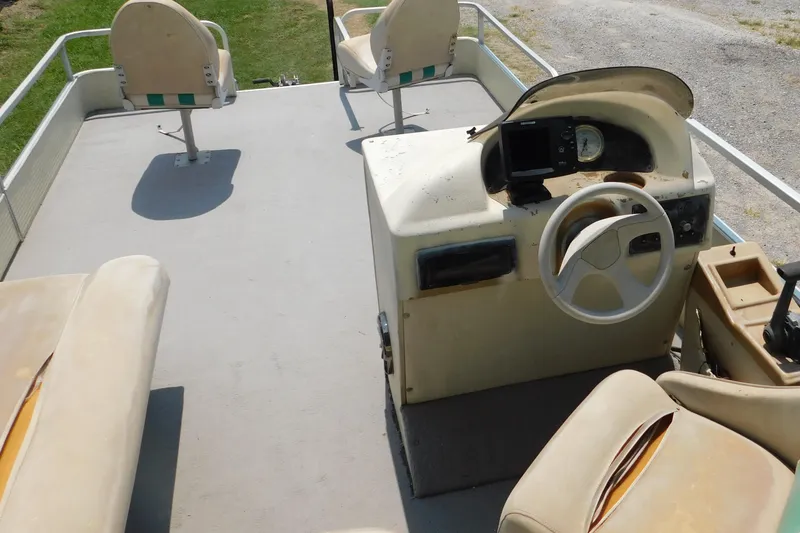 Slide: The Image of 2001 Voyager Pontoons VF20 boat interior with steering console and seating. - 5