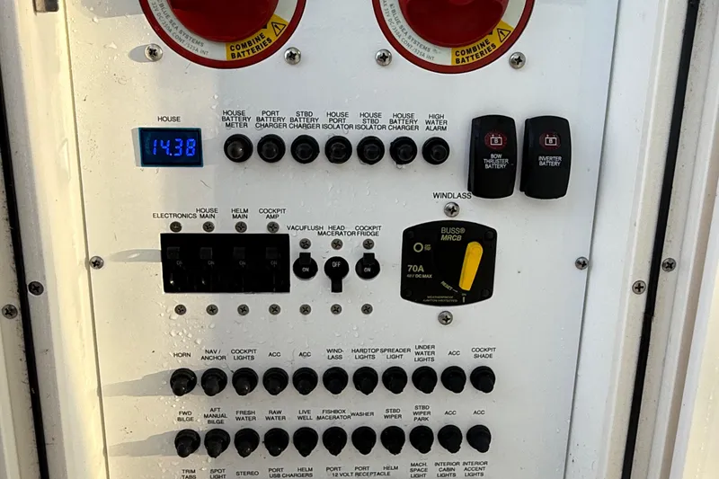 Slide: The Image of Control panel of a 2016 Pursuit DC 325 Dual Console boat, showing various switches and indicators. - 51