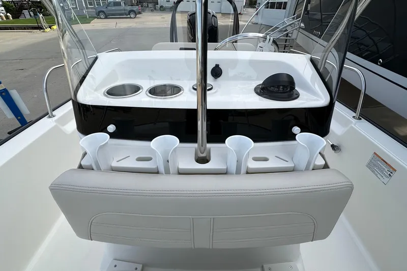 Slide: The Image of 2026 Boston Whaler 170 Montauk boat console with cup holders and navigation equipment. - 14