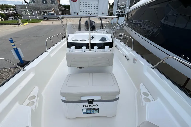 Slide: The Image of 2026 Boston Whaler 170 Montauk boat interior with seating and console view. - 15