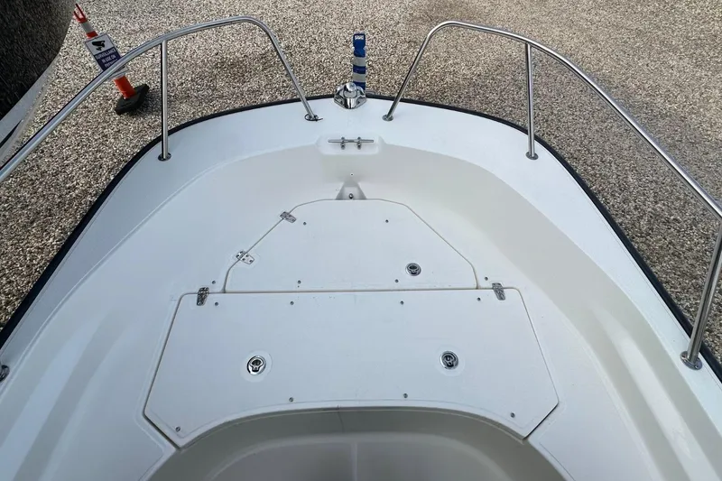 Slide: The Image of 2026 Boston Whaler 170 Montauk boat deck with stainless steel railings. - 17