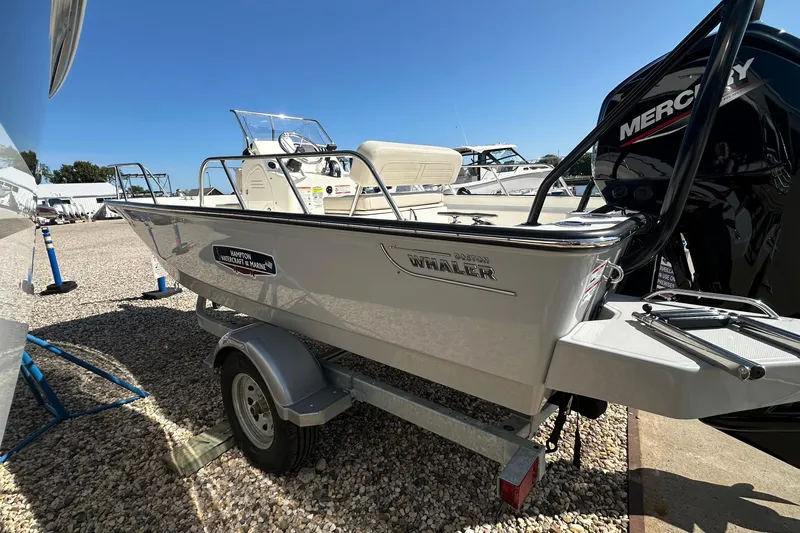 Slide: The Image of 2026 Boston Whaler 170 Montauk boat on trailer, displayed outdoors under clear blue sky. - 3