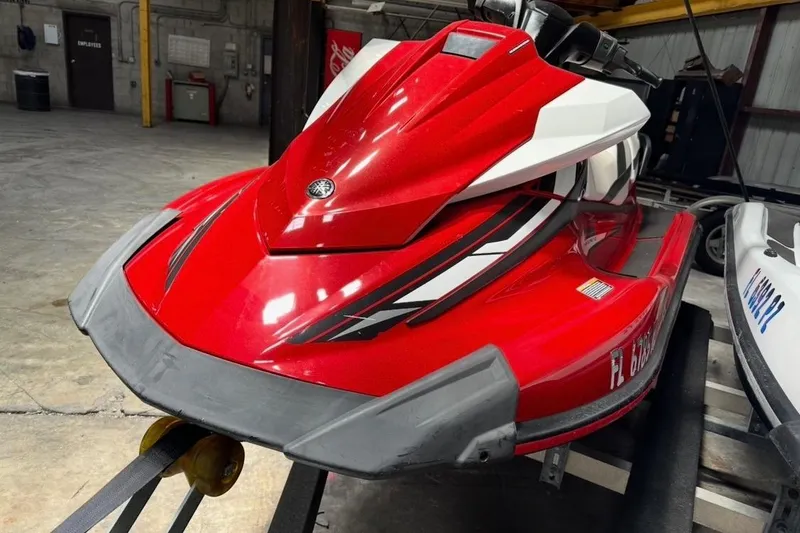 Slide: The Image of Red 2017 Yamaha WaveRunner VX 110 Cruiser in a garage setting. - 2