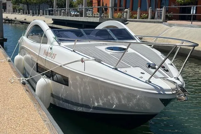 Slide: The Image of 2024 Bracewell 25 boat docked in a marina, featuring sleek design and modern amenities. - 10