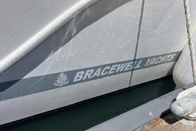 Slide: The Image of 2024 Bracewell 25 yacht side view with logo and water droplets. - 31