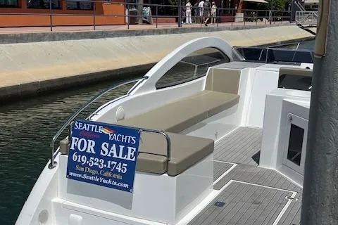 Slide: The Image of 2024 Bracewell 25 yacht for sale, docked with contact details displayed. - 32
