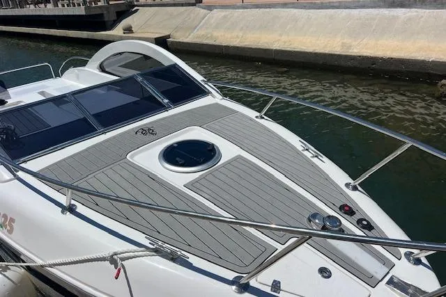 Slide: The Image of 2024 Bracewell 25 boat docked, featuring sleek design and modern deck layout. - 4