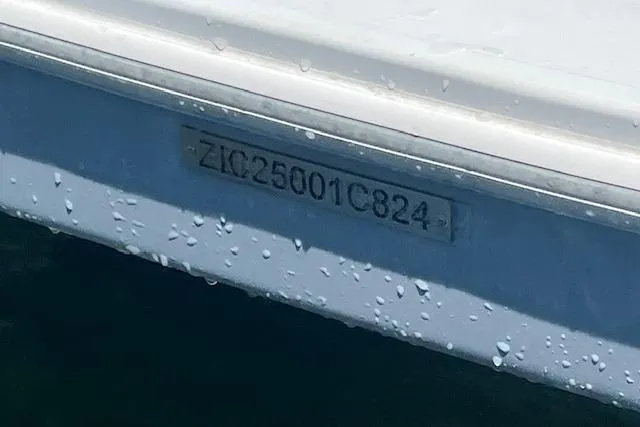 Slide: The Image of 2024 Bracewell 25 boat hull identification number with water droplets. - 7