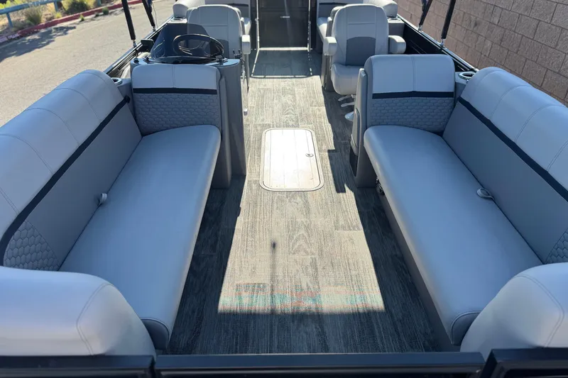 Slide: The Image of 2023 Apex Qwest 822 pontoon boat interior with gray seating and modern design. - 8