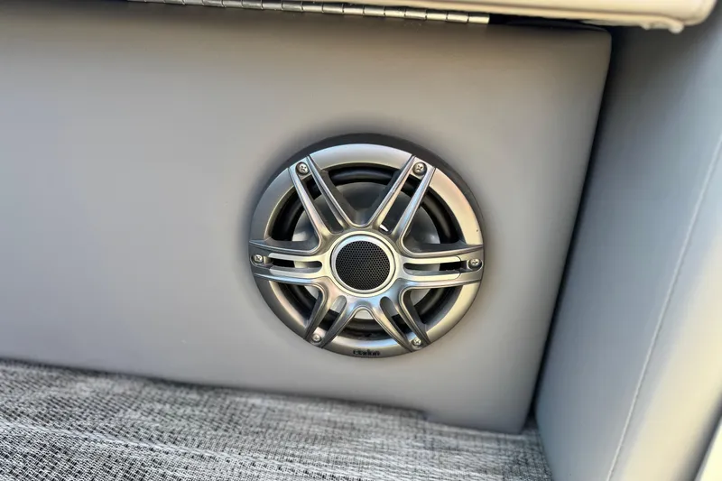Slide: The Image of Speaker on Apex Qwest 822 boat, 2023 model, with sleek metallic design. - 16