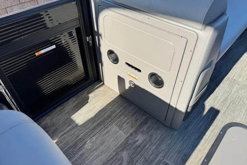 Slide: The Image of Interior of 2023 Apex Qwest 822 boat showing seating and storage compartment. - 19