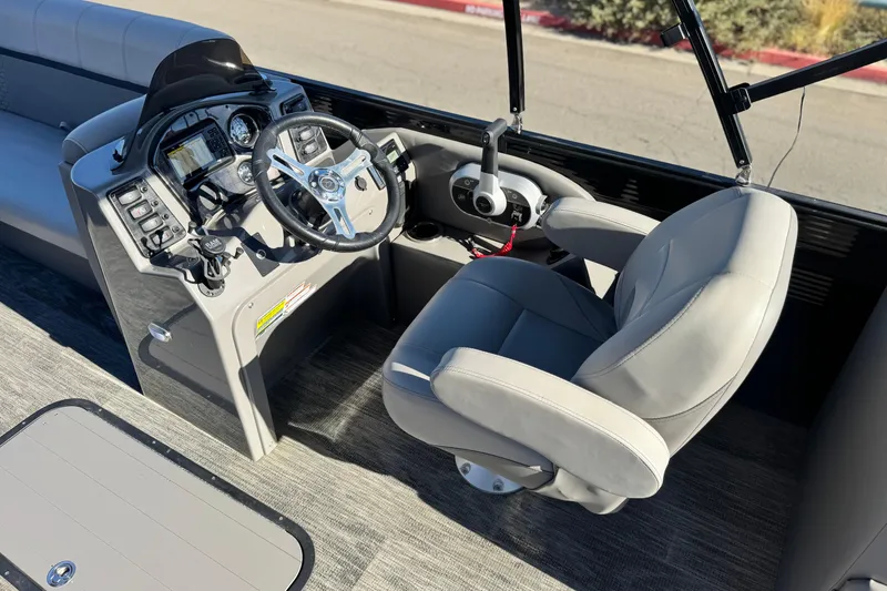 Slide: The Image of Captain's seat and control panel of 2023 Apex Qwest 822 boat. - 21
