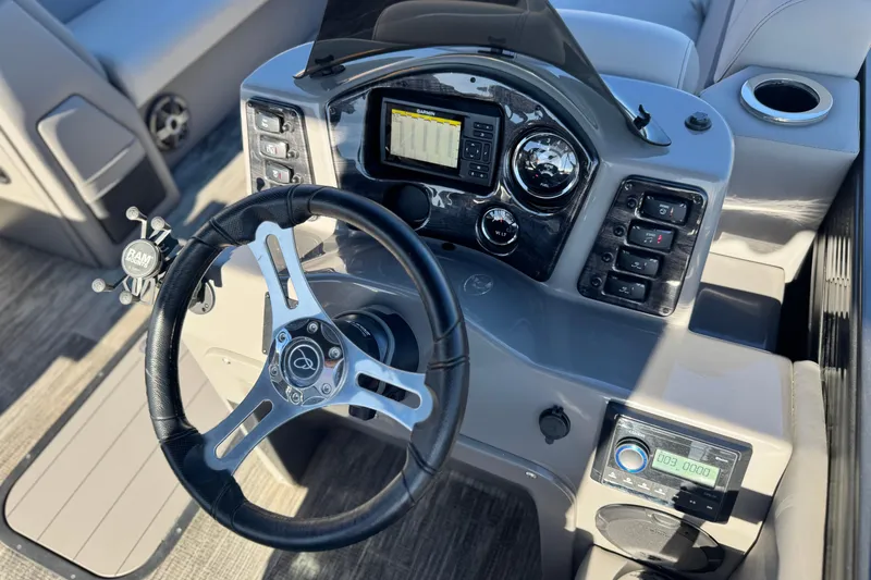 Slide: The Image of Steering console of 2023 Apex Qwest 822 boat with modern controls and dashboard. - 23