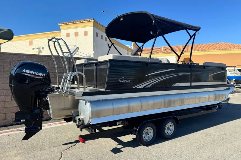 Slide: The Image of 2023 Apex Qwest 822 pontoon boat with Mercury engine, parked on a trailer. - 6