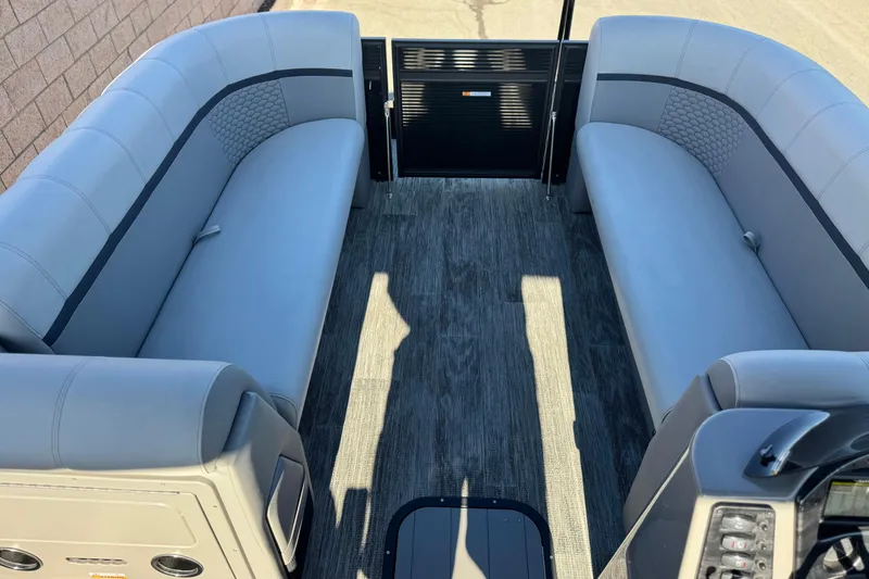 Slide: The Image of Interior of 2023 Apex Qwest 822 pontoon boat with gray seating and flooring. - 9