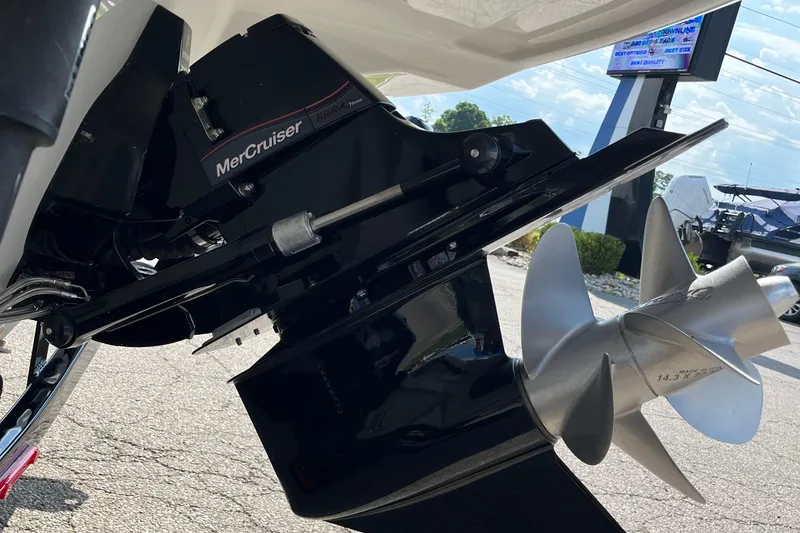 Slide: The Image of Close-up of a 2026 Crownline 270 SS boat's MerCruiser engine and propeller. - 13