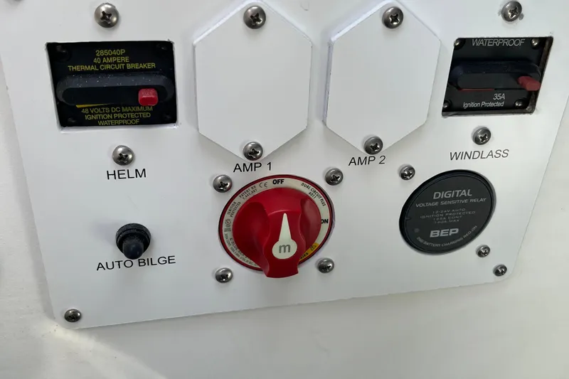 Slide: The Image of Control panel of 2026 Crownline 270 SS boat with switches and circuit breakers. - 5