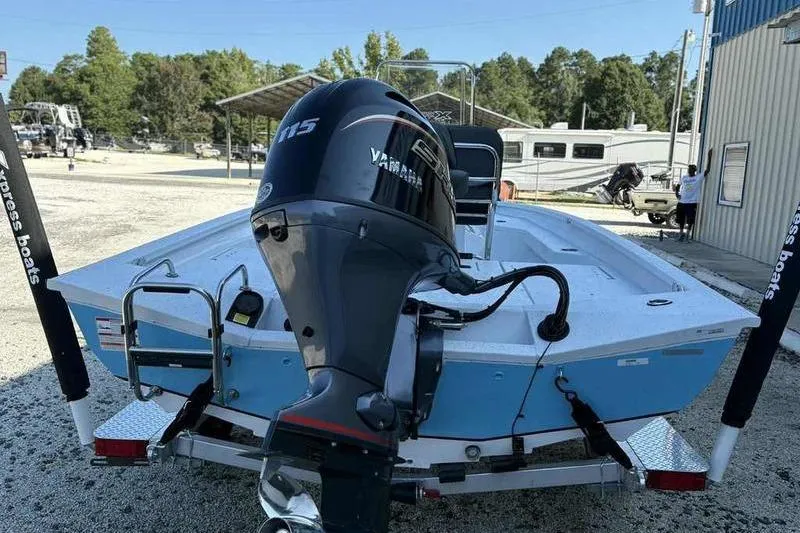 Slide: The Image of 2026 Xpress H20B boat with Yamaha 115 engine, parked outdoors. - 3