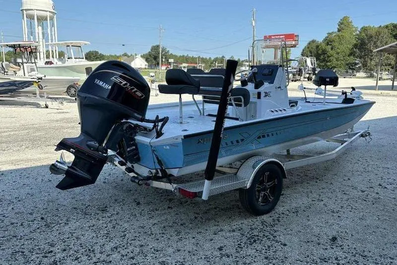 Slide: The Image of 2026 Xpress H20B boat with Yamaha engine on trailer in outdoor setting. - 6