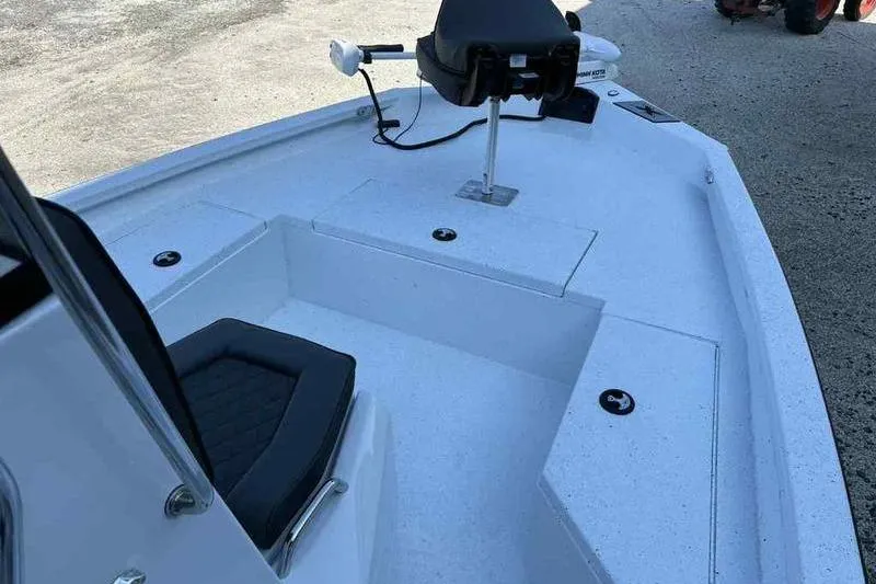Slide: The Image of 2026 Xpress H20B boat interior with seating and steering console. - 8