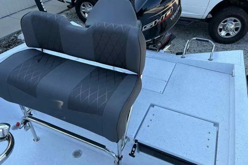 Slide: The Image of 2026 Xpress H20B boat interior with gray seating and Yamaha engine. - 9