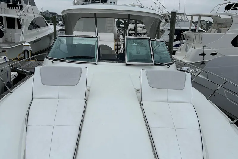 Slide: The Image of 2016 Formula 40 Cruiser yacht with sun loungers, docked at marina. - 18