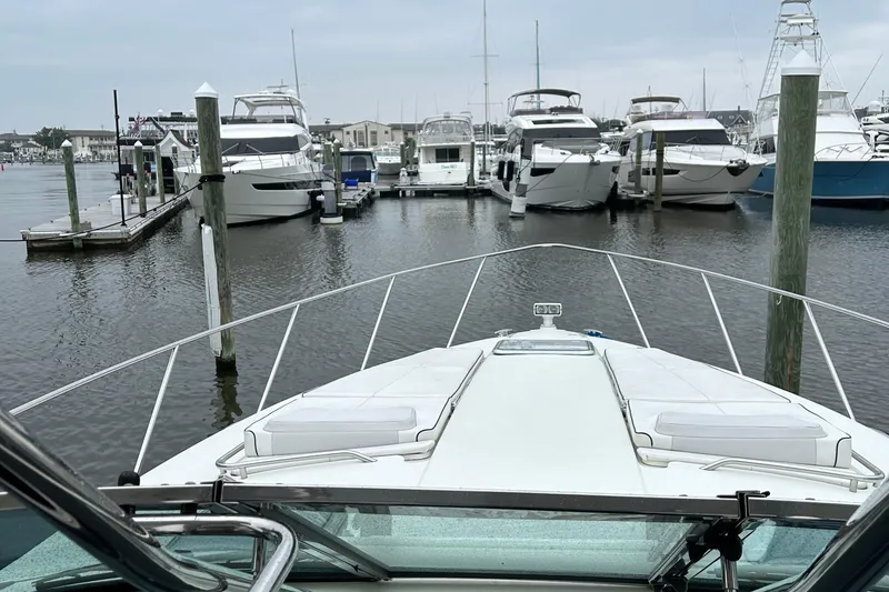 Slide: The Image of 2016 Formula 40 Cruiser docked in a marina with other boats. - 19