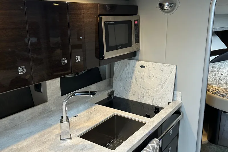 Slide: The Image of Modern kitchen in 2016 Formula 40 Cruiser yacht with sleek cabinetry and appliances. - 23