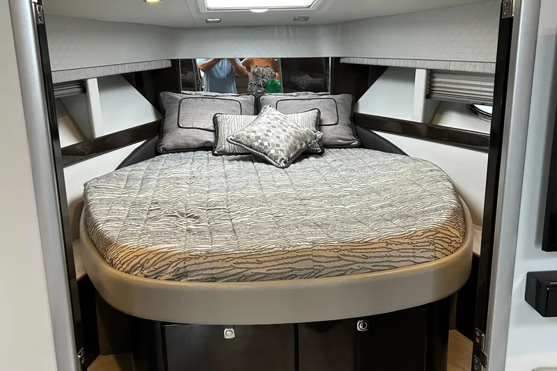 Slide: The Image of Luxurious bedroom interior of a 2016 Formula 40 Cruiser yacht with elegant bedding. - 25