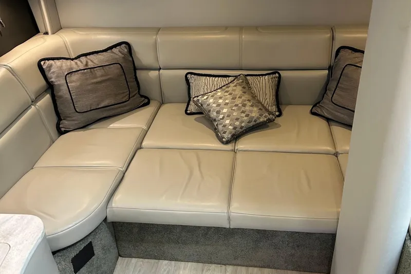 Slide: The Image of Luxurious beige leather seating with decorative pillows in a 2016 Formula 40 Cruiser. - 27