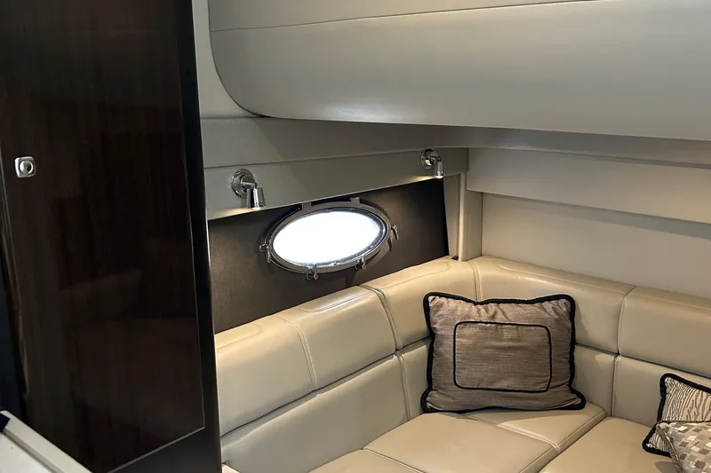 Slide: The Image of Interior of 2016 Formula 40 Cruiser with beige leather seating and porthole window. - 28
