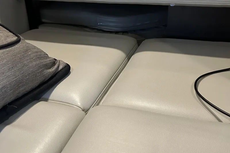 Slide: The Image of Interior seating of 2016 Formula 40 Cruiser with beige cushions and a gray pillow. - 30
