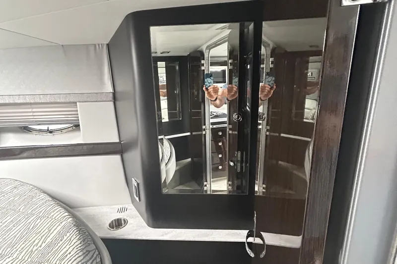 Slide: The Image of Interior of 2016 Formula 40 Cruiser with mirrored cabinet and modern design elements. - 32