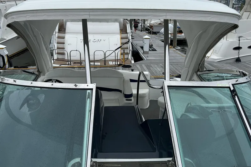 Slide: The Image of 2016 Formula 40 Cruiser yacht docked at marina, featuring open cockpit and sleek design. - 39