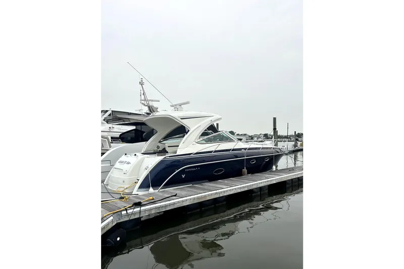 Slide: The Image of 2016 Formula 40 Cruiser yacht docked at marina, side view. - 4