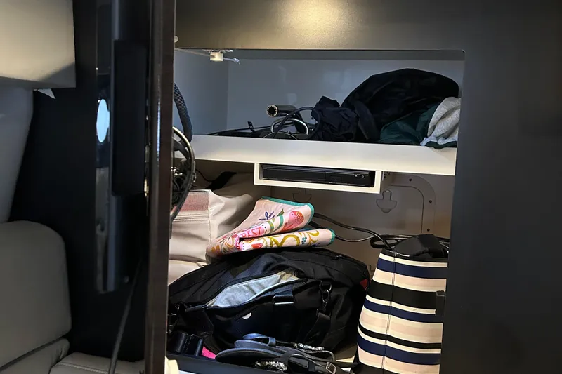 Slide: The Image of Interior storage of 2016 Formula 40 Cruiser with bags and clothing. - 40