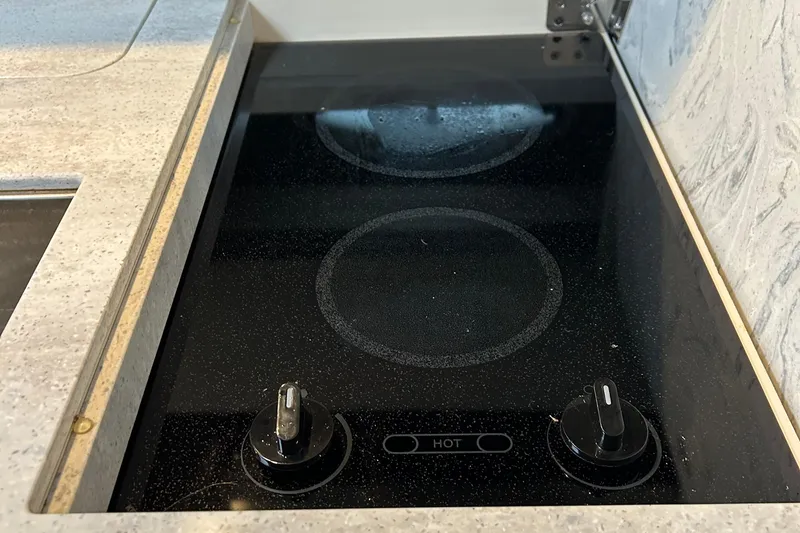 Slide: The Image of Built-in electric stove on 2016 Formula 40 Cruiser yacht kitchen countertop. - 44