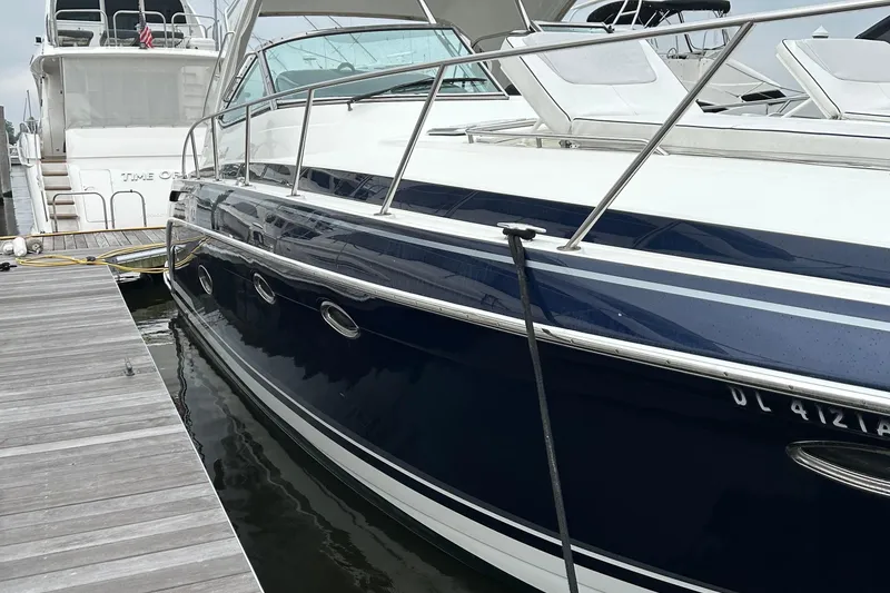 Slide: The Image of 2016 Formula 40 Cruiser yacht docked at marina, sleek design, blue hull. - 5