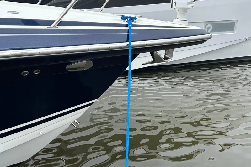 Slide: The Image of 2016 Formula 40 Cruiser docked with blue rope on calm water. - 6
