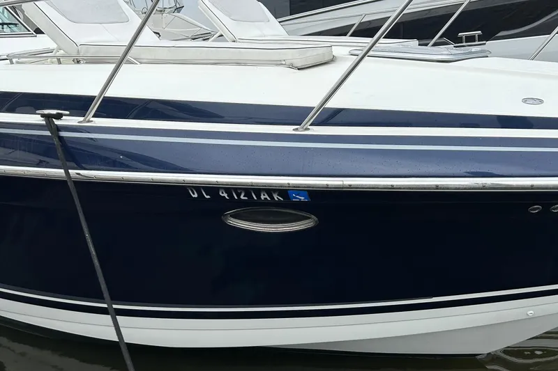 Slide: The Image of 2016 Formula 40 Cruiser boat docked, featuring sleek blue and white design. - 7