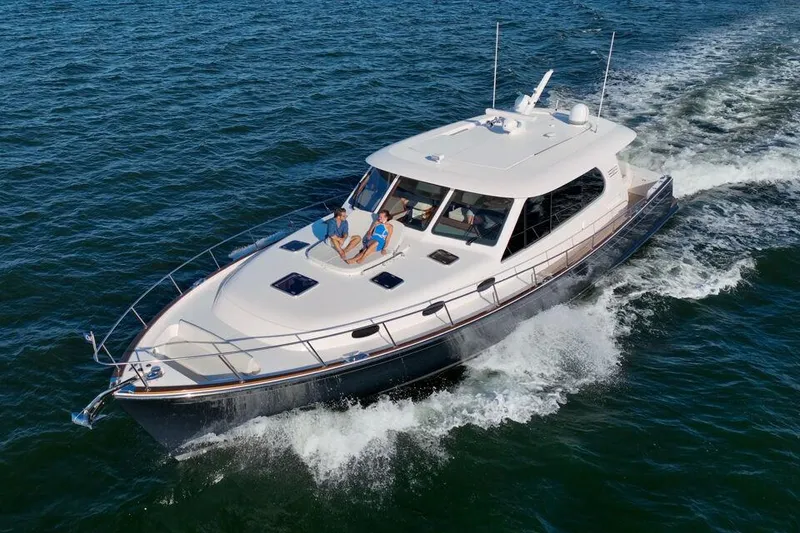 Slide: The Image of 2023 Eastbay EB60 yacht cruising on open water. - 10