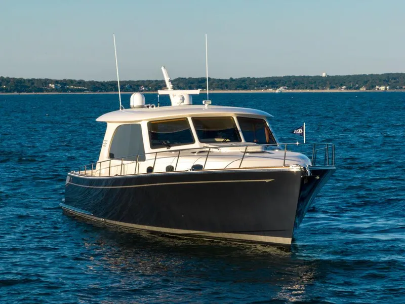 Slide: The Image of 2023 Eastbay EB60 yacht cruising on open water under clear skies. - 11