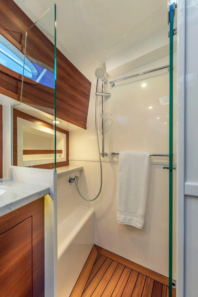 Slide: The Image of Engine room of 2023 Eastbay EB60 yacht with modern equipment and wooden flooring. - 23