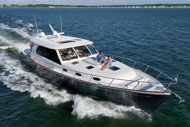 Slide: The Image of 2023 Eastbay EB60 yacht cruising on open water. - 9