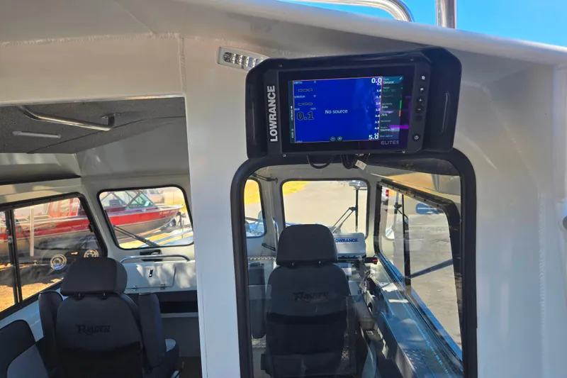 Slide: The Image of Interior of 2021 Raider 210.Explorer boat with Lowrance navigation system. - 10