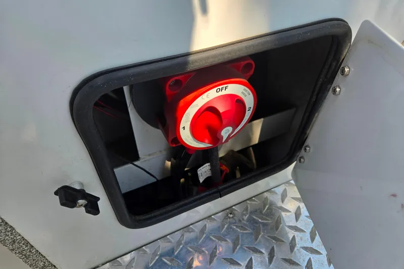 Slide: The Image of Battery switch in a 2021 Raider 210.Explorer boat compartment. - 15